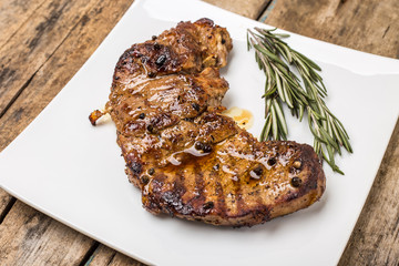 Grilled beefsteak decorated with rosemary bunch