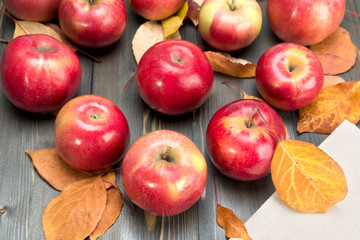 Winter red apples on a wooden table