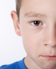 Photo of adorable young happy boy looking at camera.