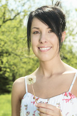 Portrait of a young beautiful woman on the nature