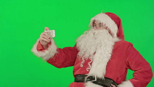 Santa Claus take a selfie on a Green Screen Chrome Key
