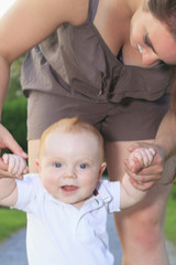 A mother walking baby forest