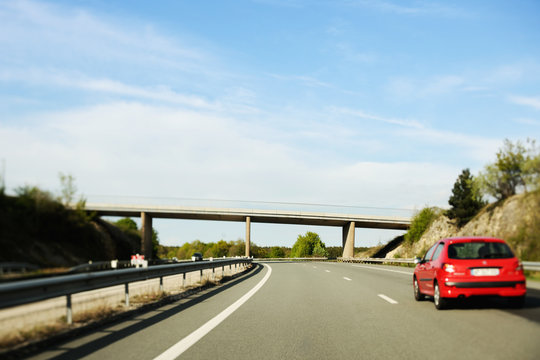 Red Car On French Highway - Tilt-shift Lens Used To Focus On The Road And Car