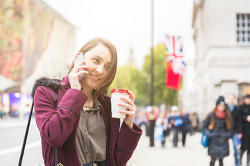 Young woman in London talking on the phone