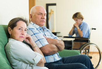 Fototapeta premium Mature couple and disabled woman indoor