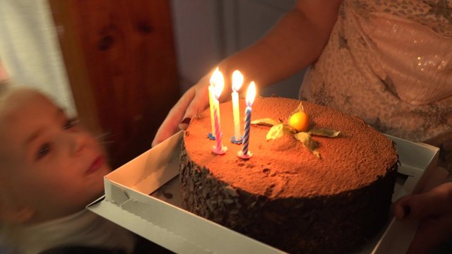 Funny Little Girl Birthday Cake. Blowing Candels. 4K UltraHD video.