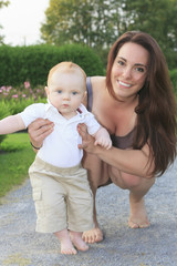 A mother walking baby forest