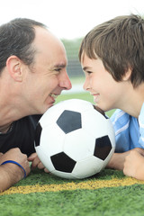 A young soccer player with father