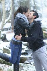 A couple having fun in the park, in winter holidays