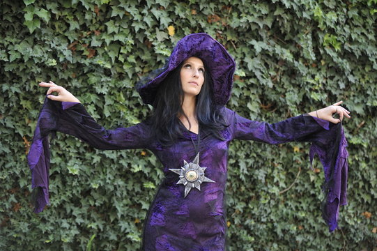 Woman dressed as a witch.
