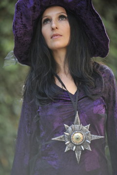 Woman dressed as a witch.
