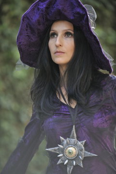 Woman dressed as a witch.
