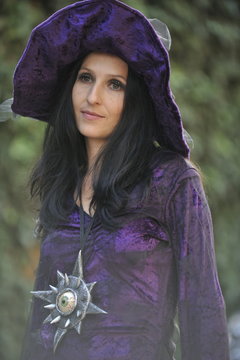 Woman dressed as a witch.
