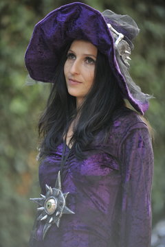 Woman dressed as a witch.
