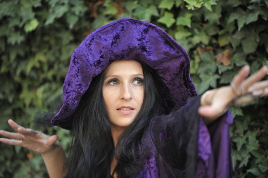 Woman dressed as a witch.
