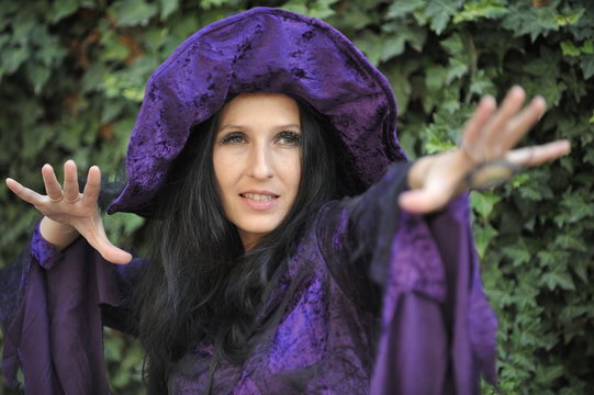 Woman dressed as a witch.

