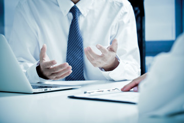 Business people Having Meeting Around Table In Modern Office