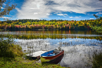 A fishing boat rests on the shore in late September on the Lake.