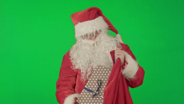 Santa Claus Packaging Gifts on a Green Screen Chrome Key