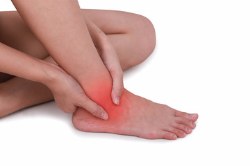 Fototapeta premium Close up suffering male pain in ankle isolated white background.