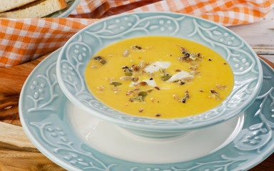 Pumpkin and carrot cream soup.