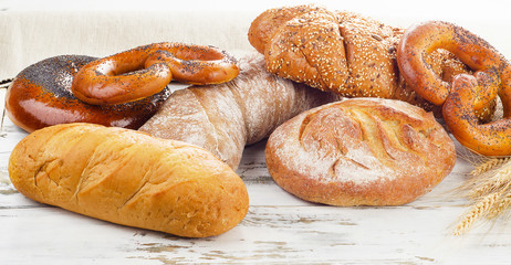fresh baked bread on a white wooden table