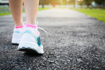 Close-up women jogging at  public park in the morning.