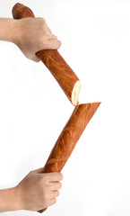 Bread baguette in his hand on a white background