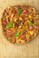 Hot Pizza with Pineapple, Ham and Bell Pepper Top View with copy