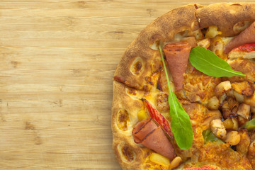 Hot Pizza with Pineapple, Ham and Bell Pepper Top View with copy