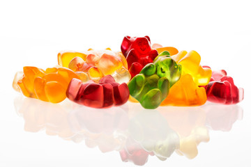 Heap of jelly bears or gummy bears candies isolated on white