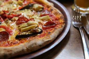 Wood fired eggplant artichoke salami pizza