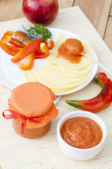 Homemade apple and pepper to cheese confiture, closeup, selective focus