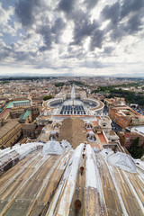 Vatican dome under a cloudy sky