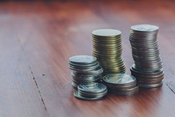 Coins stacking up high on the wood floor