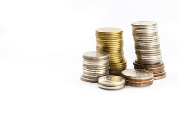 Group of coins stacking up in white isolated background.