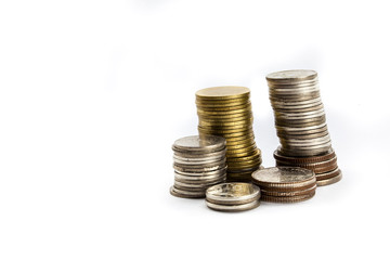 Group of coins stacking up in white isolated background.