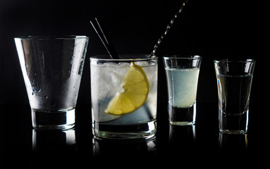 Cocktail making on the black background