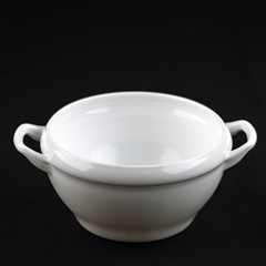 White ceramic tureen on a black background