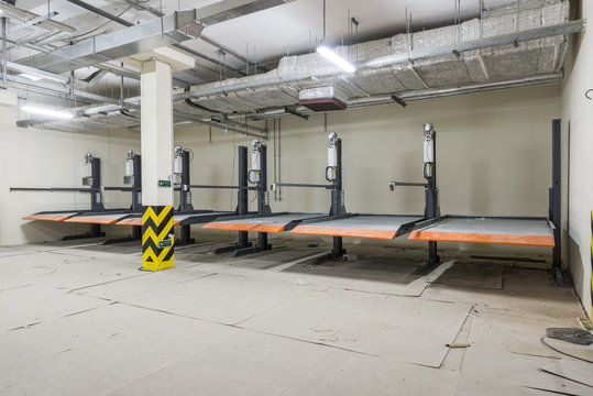Hydraulic lifts for the car in the underground parking.