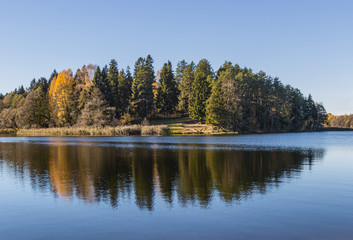 Autumn landscape with lake and forest