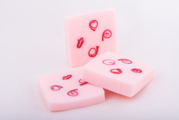 Мыло розовое ручной работы на светло-сером фоне (Handmade pink soap on a light grey background)