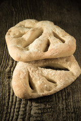 Fresh homemade bread on light grey table. Selective focus. Shall
