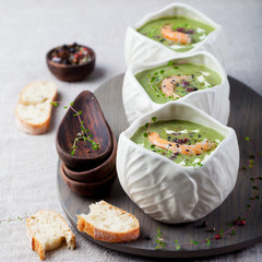 Pumpkin soup with salty popcorn in a white ceramic bowl 