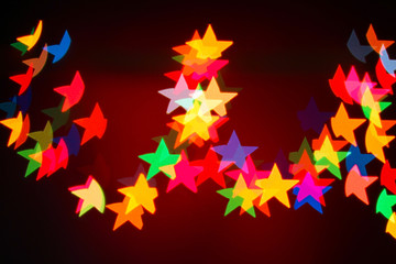 Background of Christmas lights garlands in the shape of stars