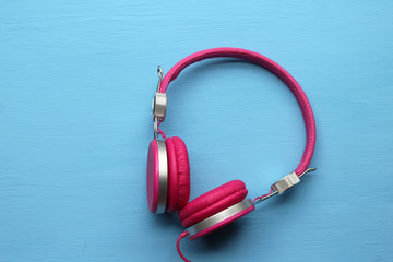 Pink headphones on blue background