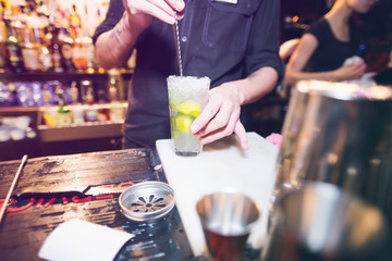 Fototapeta na wymiar Barman stir alcohol 