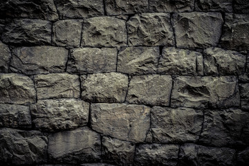 Background texture with rough wall of stone blocks