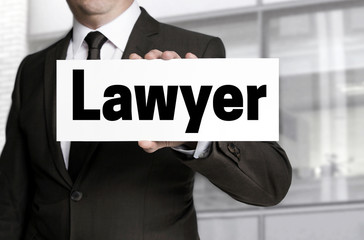 Lawyer sign is held by businessman concept