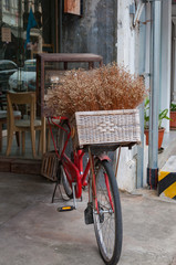 Vintage bicycle on the street with flower bouquet  in Phuket, Th